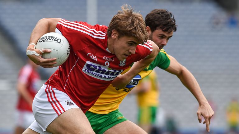 Cork midfielder Ian Maguire is tracked by Odhrán Mac Niallais