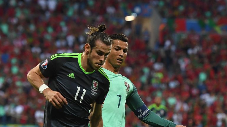 Bale and Ronaldo compete for the ball during Portugal's 2-0 win