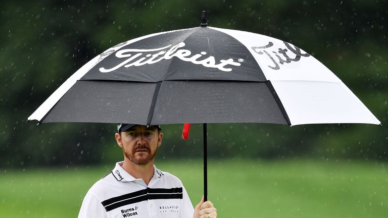 Jimmy Walker defied the rain to reclaim the lead after 54 holes