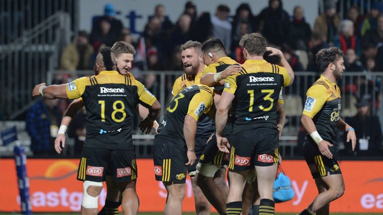 The Hurricanes celebrate after their win over the Crusaders