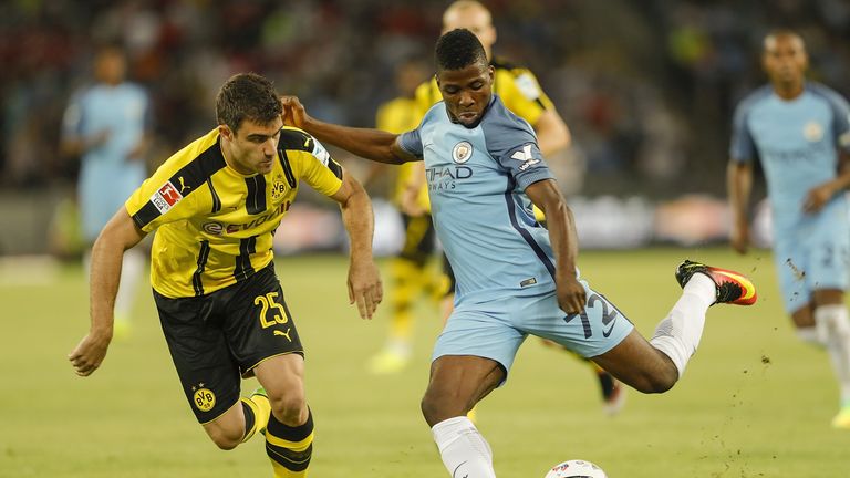 Kelechi Iheanacho (right) takes on Sokratis Papastathopoulos