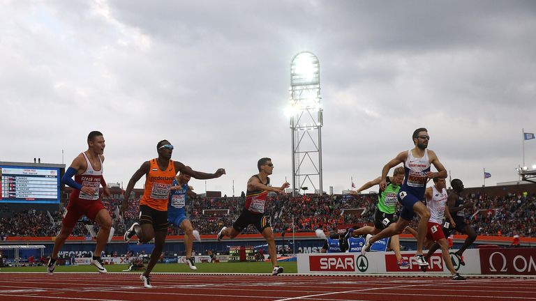 Martyn Rooney of Great Britain crosses the finish line to win gold in the final of the mens 400m