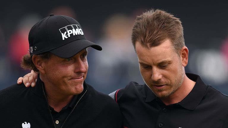 Stenson (right) consoles Mickelson on the 18th green after closing out his win 