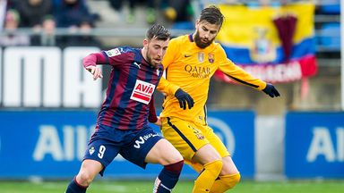 Image of Sergi Enrich tussles with Barcelona's Gerard Pique last season
