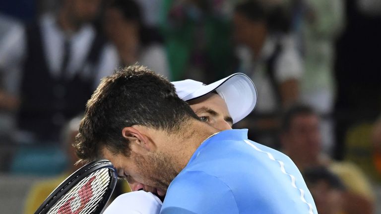 Andy Murray and Juan Martin del Potro embrace after the men's single final