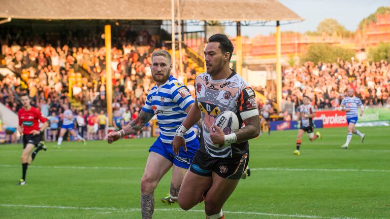 Denny Solomona escapes the clutches of Wigan's Sam Tomkins on his way to the tryline