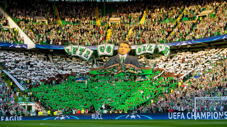 Celtic fans show a display reading 'Let's go all in' before the start of the game