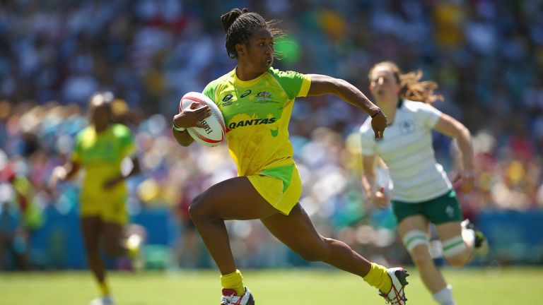 Ellia Green of Australia breaks away to score a try