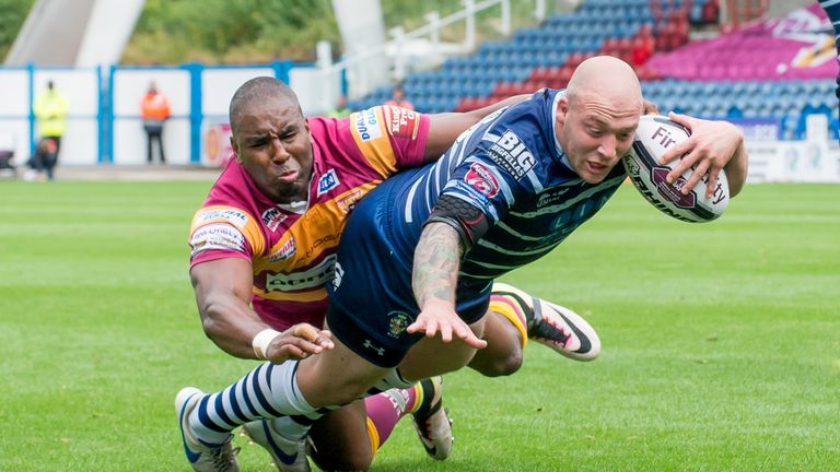 Michael Lawrence is unable to prevent Featherstone's John Davies from scoring