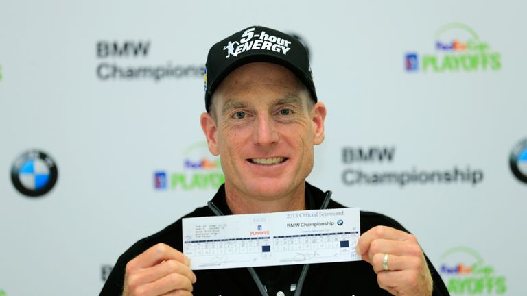 Jim Furyk holds up his scorecard after his 12-under 59 at the BMW Championship in 2013