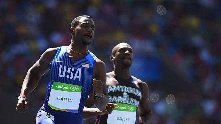 Justin Gatlin (L) ran the fastest time in the heats