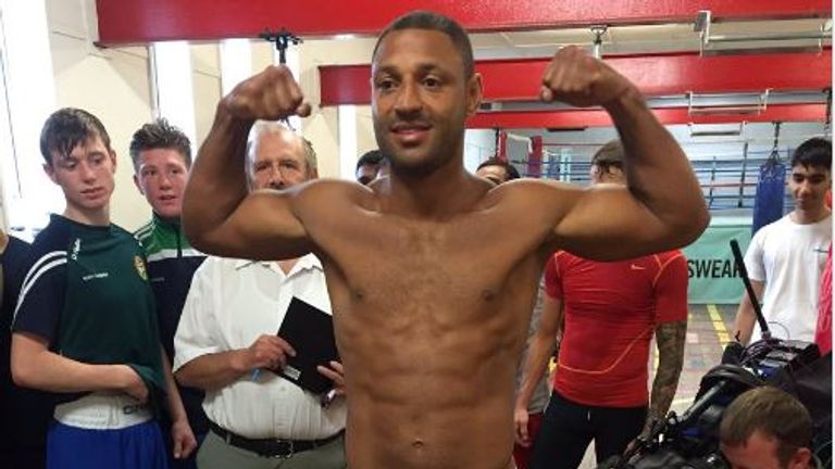 Brook flexes his muscles after weighing in at 176lbs