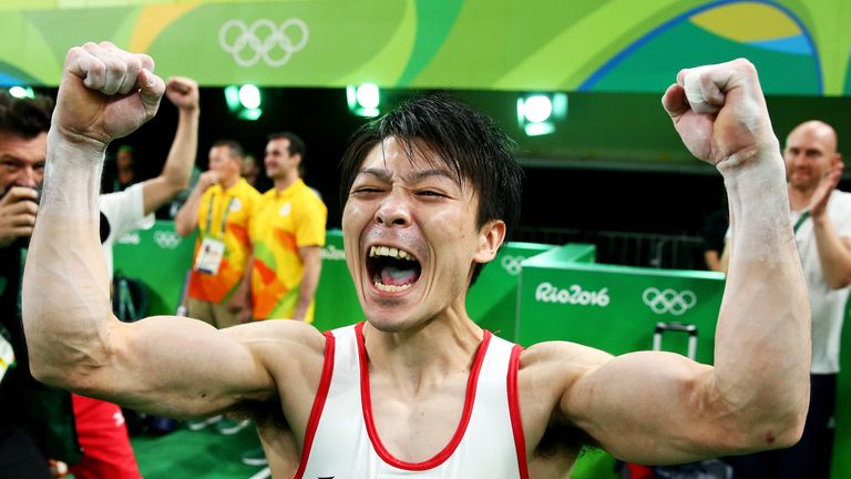 Kohei Uchimura celebrates winning the gold medal