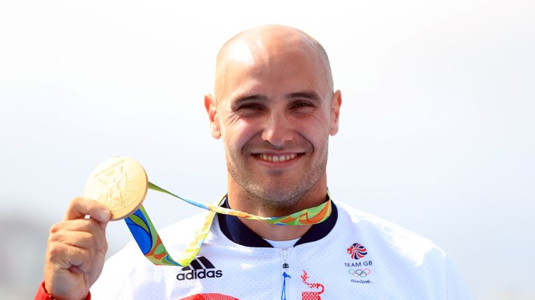 Heath proudly displays his gold medal
