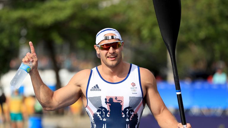 Liam Heath celebrates winning gold in the men's 200m kayak single 