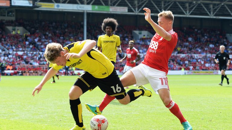 Matt Palmer (left) is tackled by Ben Osbourne