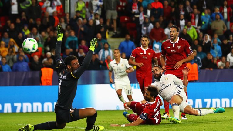 Sergio Rico (left) could not prevent Dani Carvajal's late winner for Real Madrid in the Super Cup final