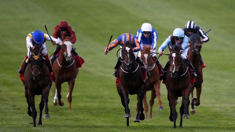 Seamie Heffernan and Brave Anna get the better of a battle with Roly Poly to win the Cheveley Park Stakes, with Lady Aurelia (far left) fading into third.