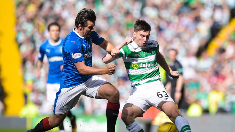 Rangers' Joey Barton challenges Kieran Tierney of Celtic