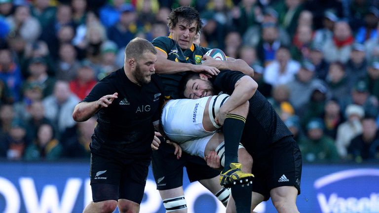 Eben Etzebeth is tackled by Dane Coles (right)