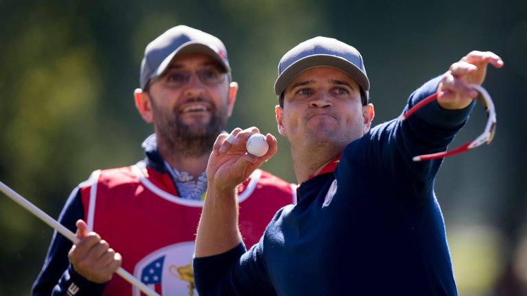 Zach Johnson throws his ball into the crowd as he celebrates his win at Hazeltine