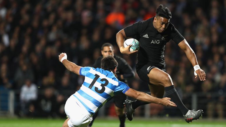 Julian Savea breaks through the tackle of Matias Orlando