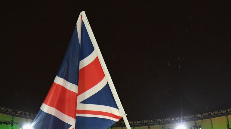 Kadeena Cox carries the Great Britain flag during the closing ceremony 