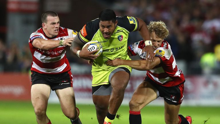 Leicester's Manu Tulagi is tackled by Matt Scott (left) and Billy Twelvetrees (right)