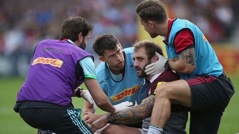 Joe Marler receives treatment after being knocked unconscious