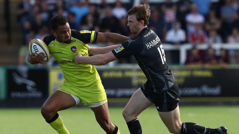 Telusa Veainu fends off the attentions of Simon Hammersley