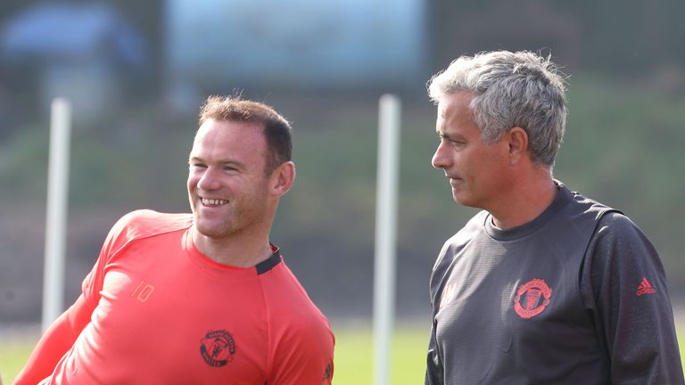 Jose Mourinho and Wayne Rooney look on during a Manchester United training session