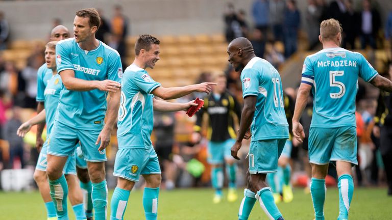 Burton's Will Miller and Lloyd Dyer celebrate after grabbing a point against Wolves in their Sky Bet Championship match