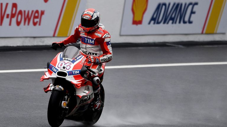 Ducati Team's Italian rider Andrea Dovizioso celebrates after winning the 2016 Malaysian MotoGP