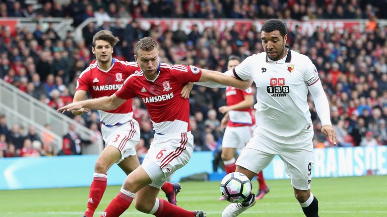 Ben Gibson of Middlesbrough and Troy Deeney of Watford battle for possession