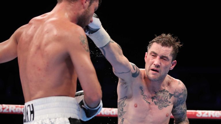 Burns lands a punch on Relikh on his way to a successful defence of his WBA super-lightweight world title