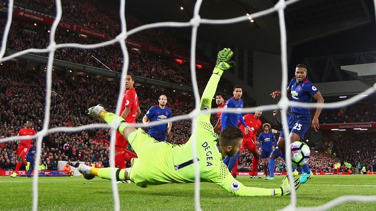 David de Gea gets down to save Emre Can's goal-bound shot