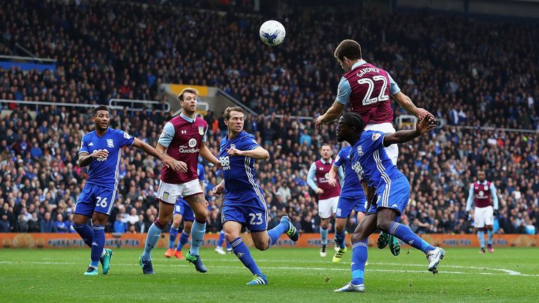 Gary Gardner of Aston Villa scores against Birmingham