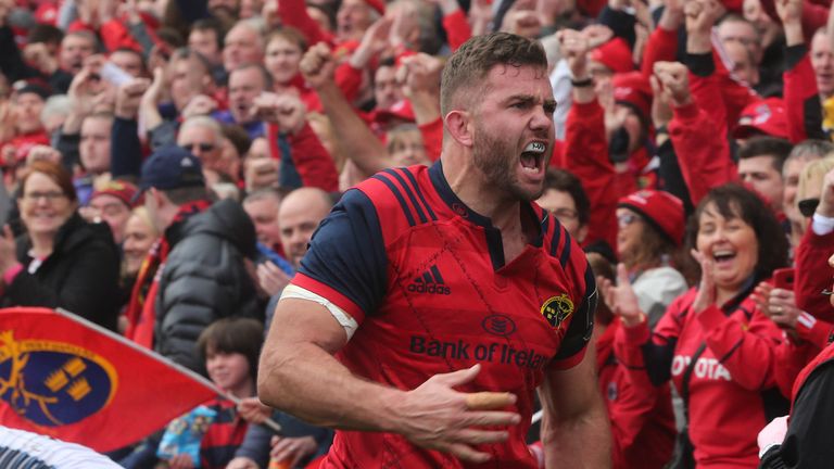 Munster's Jaco Taute celebrates scoring a try