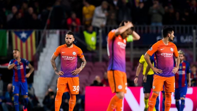 Man City's players look dejected in Barcelona