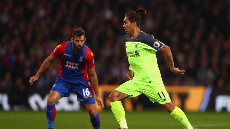 Roberto Firmino takes the ball past Joe Ledley