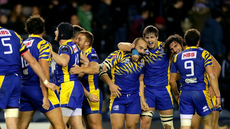 Zebre players celebrate the final whistle at Murrayfield