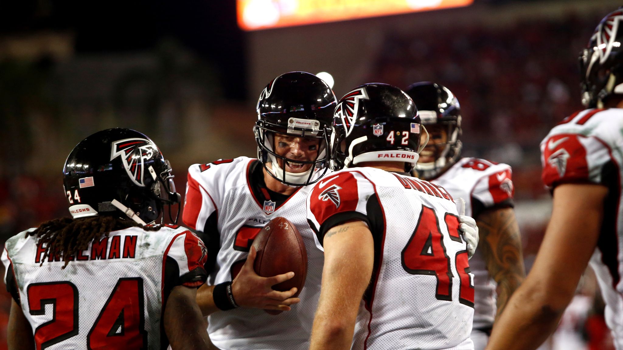 Atlanta Falcons players have a team huddle as they call a time out