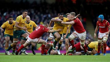 Tevita Kuridrani is tackled by Ken Owens and Bradley Davies of Wales