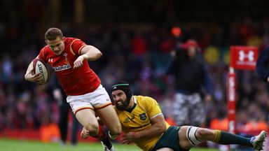 Hallam Amos of Wales is hauled down by Scott Fardy during Saturday's defeat to Australia