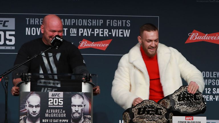 Conor McGregor takes Eddie Alvarez's lightweight belt during the UFC 205 press conference at Madison Square Garden