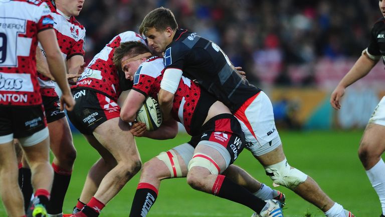 Will Safe of Gloucester is tackled by George Perkins of Saracens