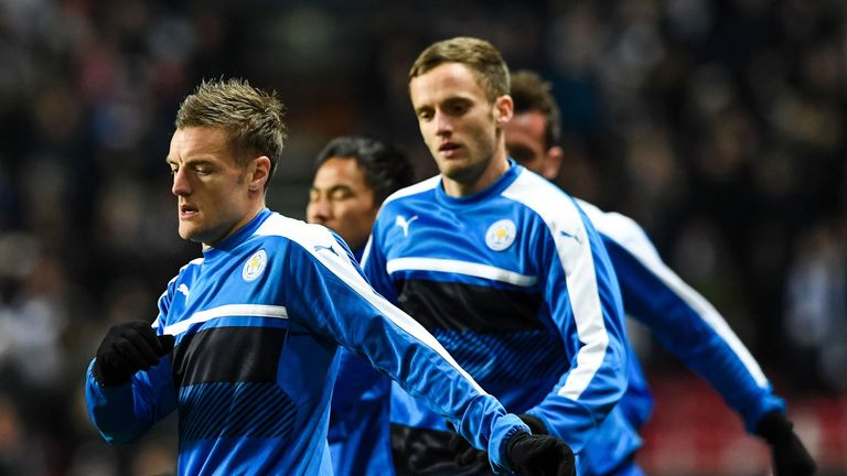 Leicester City's players warm up in the cold prior to kick off