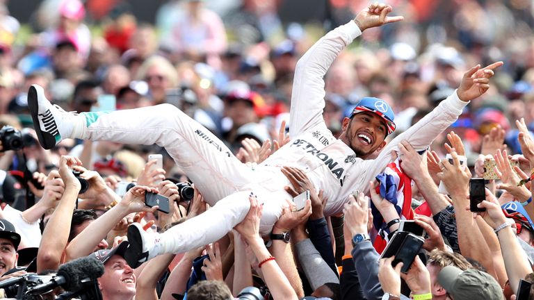 Lewis Hamilton crowdsurfs after his British GP victory - Picture from Getty Images