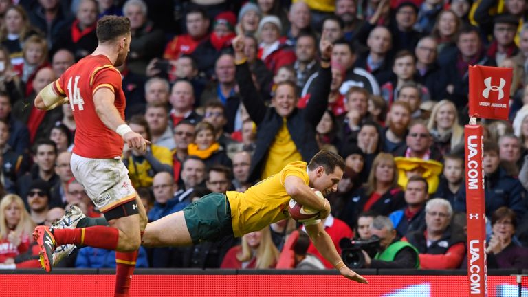 Man of the match Bernard Foley dives over to score Australia's fourth try