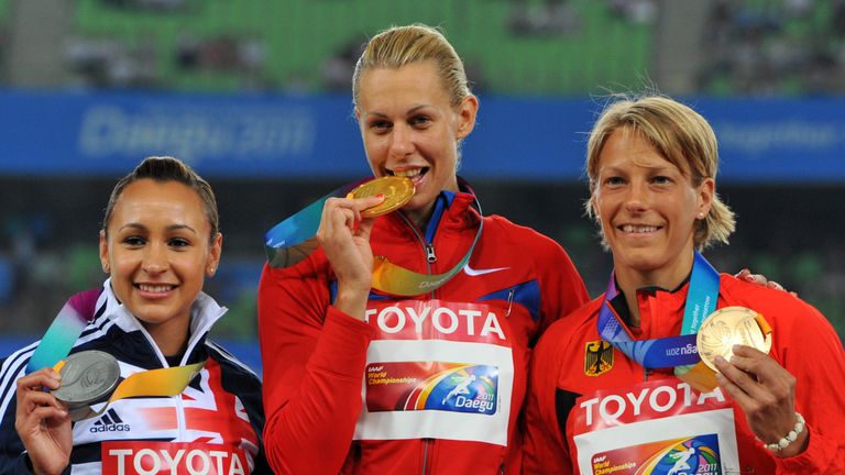 2011 gold medallist Russia's Tatyana Chernova (C) poses with silver medallist Ennis (L) and bronze medallist Germany's Jennifer Oeser (R)